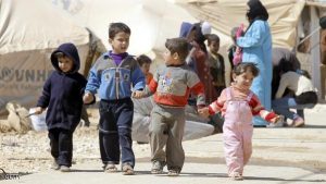 TO GO WITH AFP STORY BY KAMAL TAHA Syrian children walk amid tents at the Zaatari refugee camp, near the Syrian border with Jordan in Mafraq on March 7, 2013. The number of Syrians who have fled their country since a deadly civil conflict erupted two years ago has hit one million, the UN's refugee agency said on March 6. AFP PHOTO/KHALIL MAZRAAWI (Photo credit should read KHALIL MAZRAAWI/AFP/Getty Images)